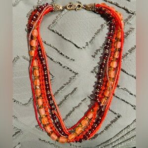 Seven Stranded Glass bead Necklace with motif hook latch.